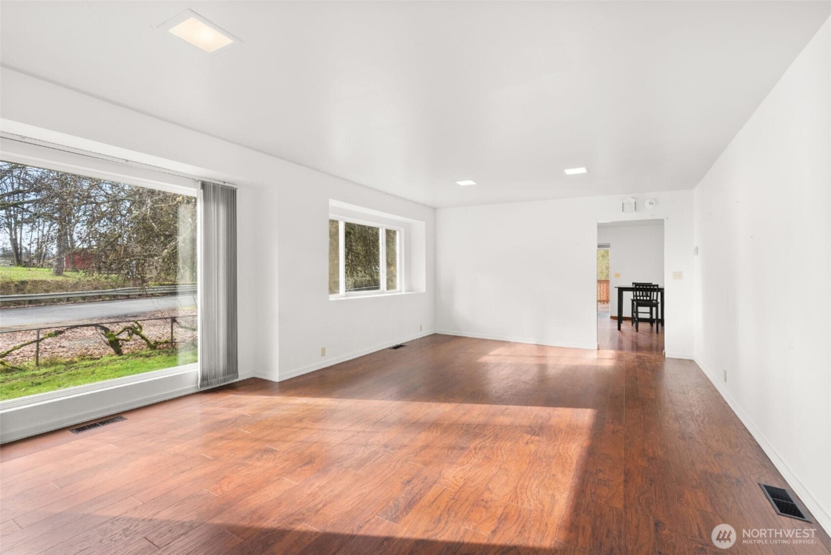 418 Southwest Canyon Loop Winlock, WA 98596 - Photo 5 of 35 a view of a livingroom with wooden floor and window