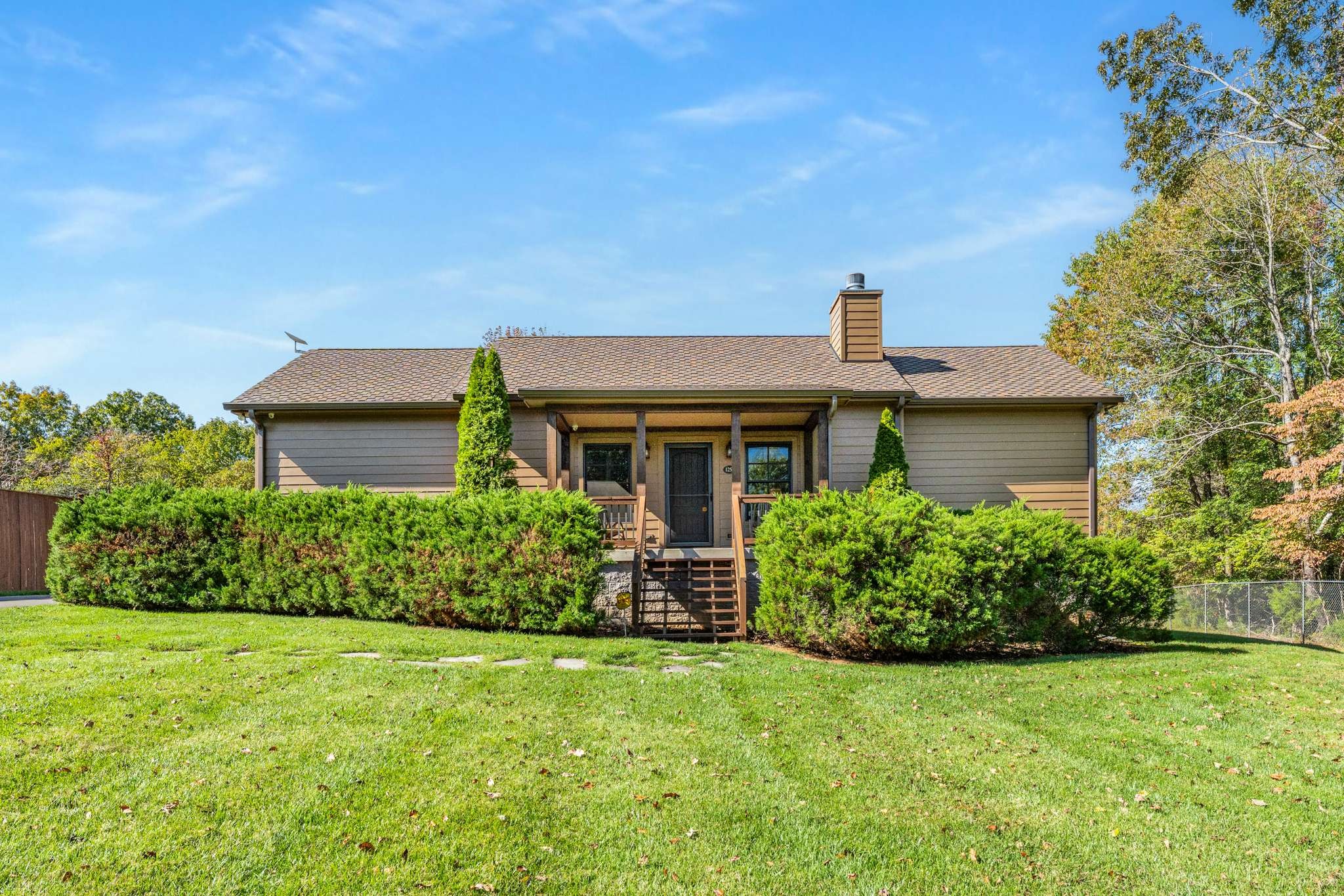 front view of a house with a yard