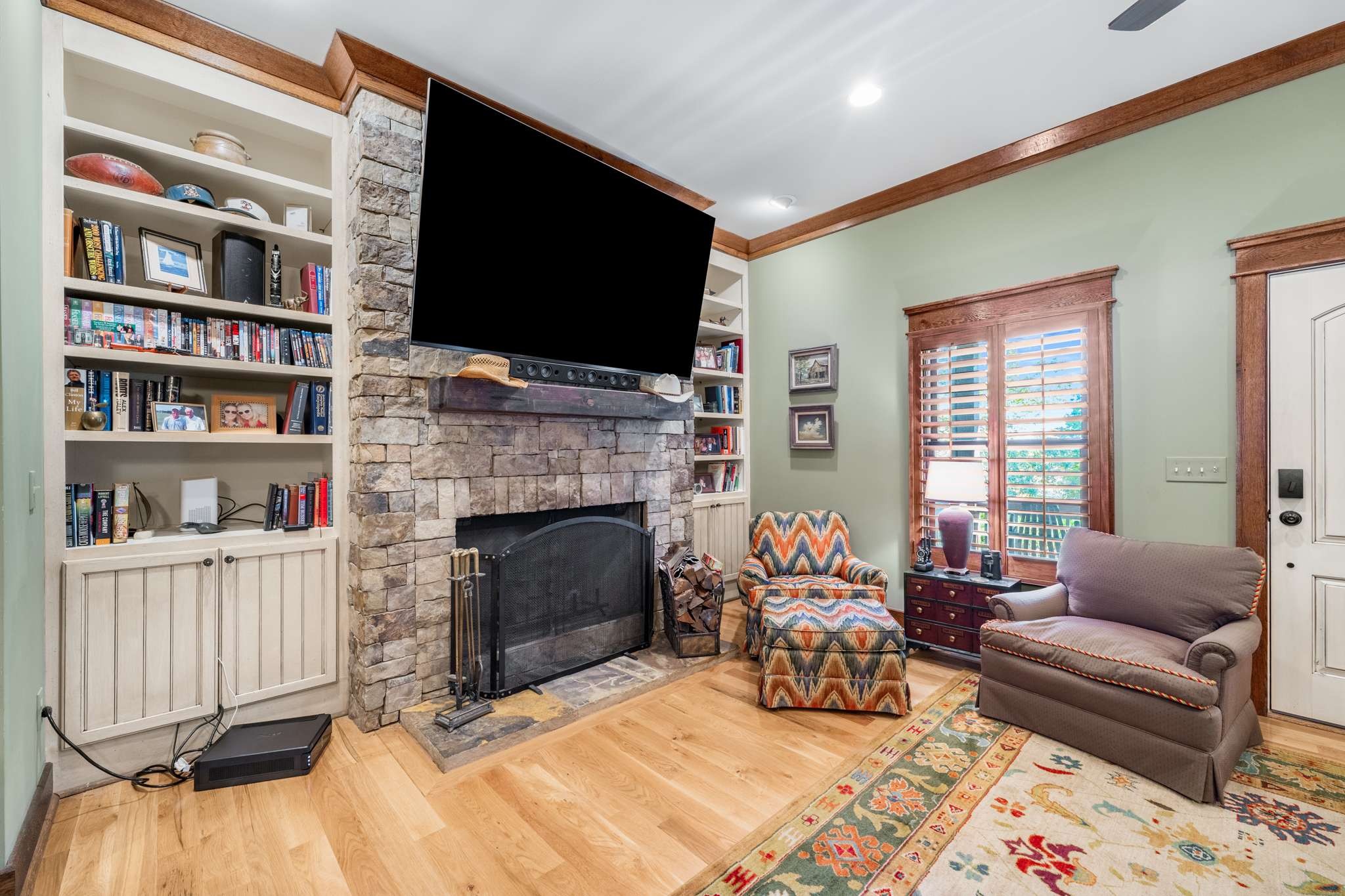 1257 Harris Hollow Road Charlotte, TN 37036 - Photo 14 of 53 a living room with furniture fireplace and a flat screen tv