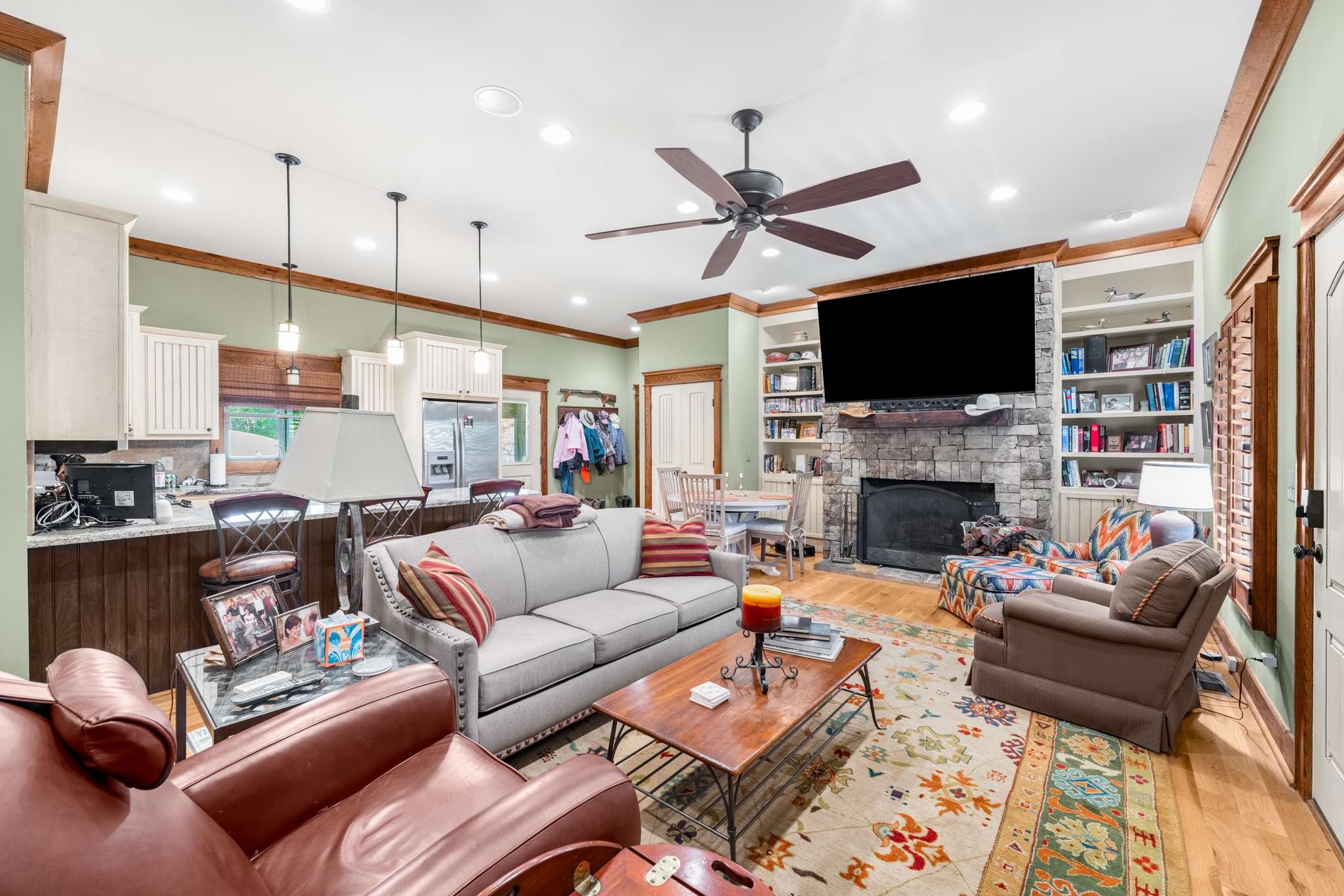 1257 Harris Hollow Road Charlotte, TN 37036 - Photo 17 of 53 a living room with furniture a fireplace and a flat screen tv