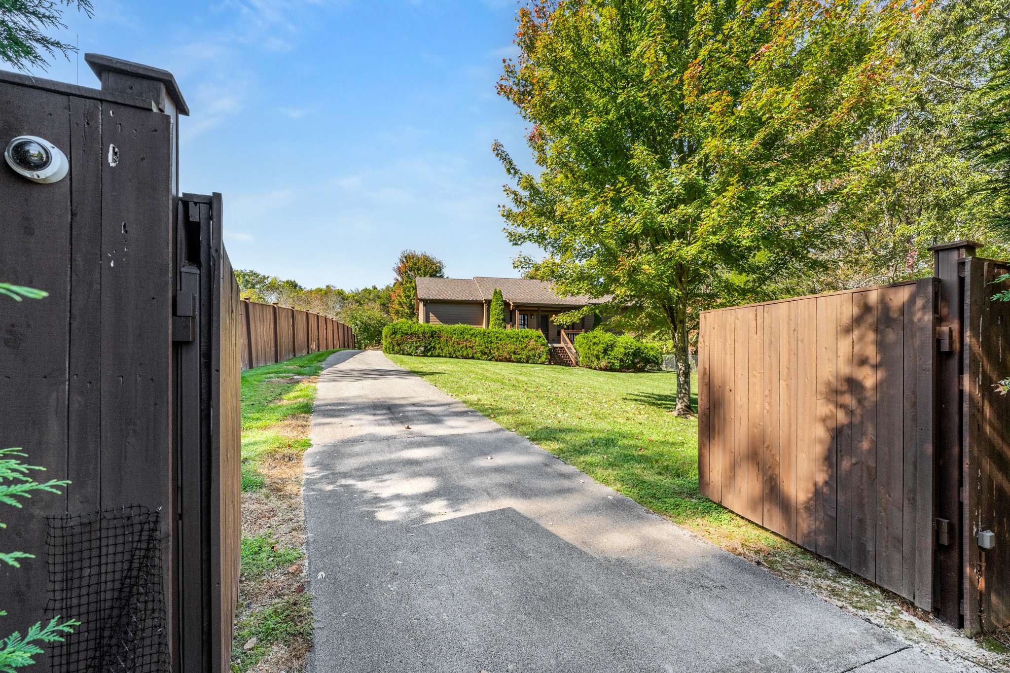 1257 Harris Hollow Road Charlotte, TN 37036 - Photo 2 of 53 a view of a house with a small yard and a large tree
