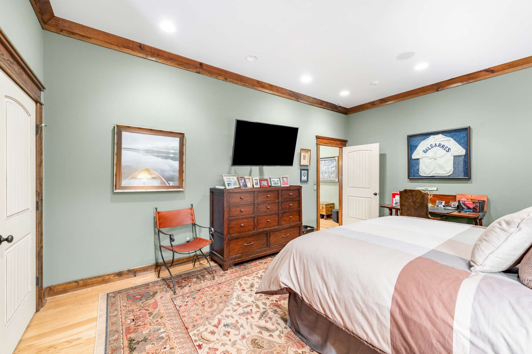 1257 Harris Hollow Road Charlotte, TN 37036 - Photo 22 of 53 a bedroom with a bed and a flat screen tv