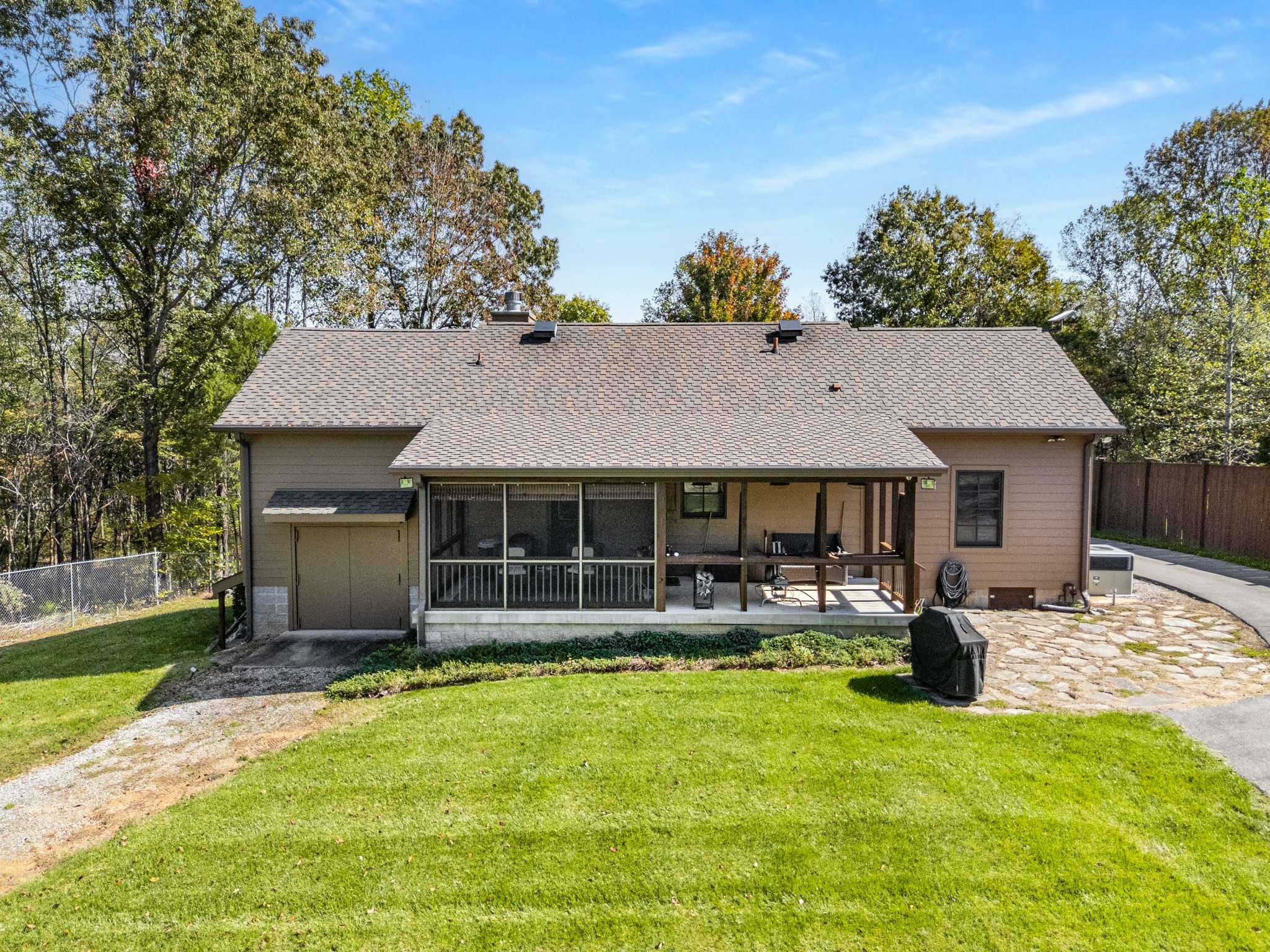 1257 Harris Hollow Road Charlotte, TN 37036 - Photo 32 of 53 a front view of a house with swimming pool and porch