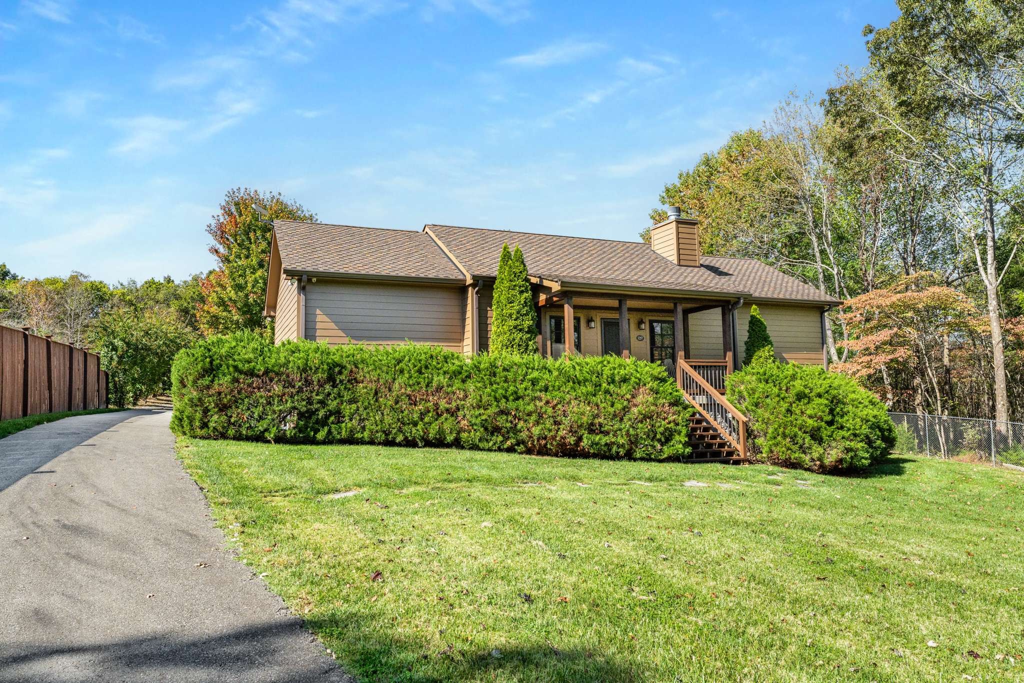 1257 Harris Hollow Road Charlotte, TN 37036 - Photo 4 of 53 a front view of a house with a yard