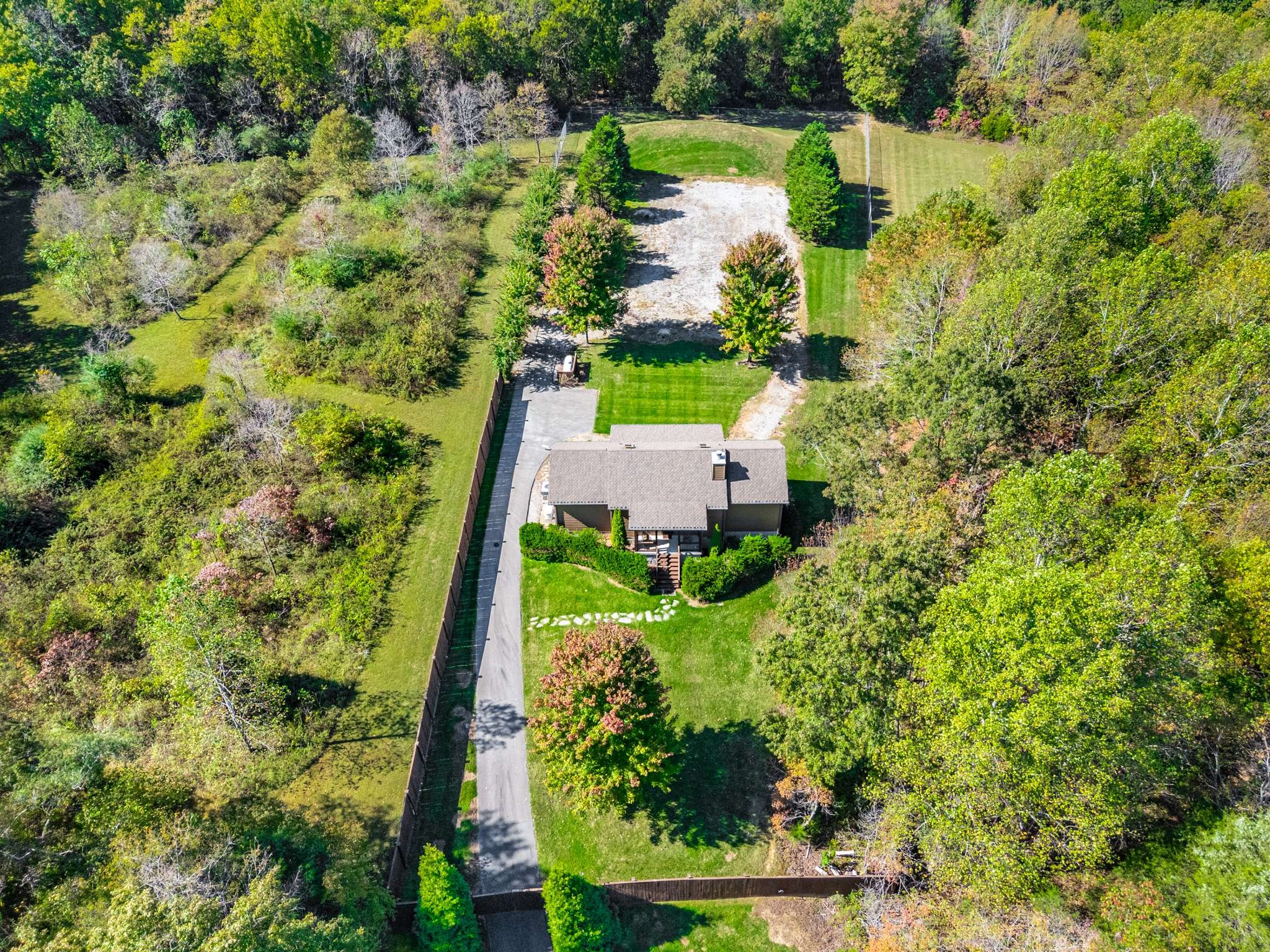 1257 Harris Hollow Road Charlotte, TN 37036 - Photo 48 of 53 an aerial view of residential house with outdoor space and trees all around