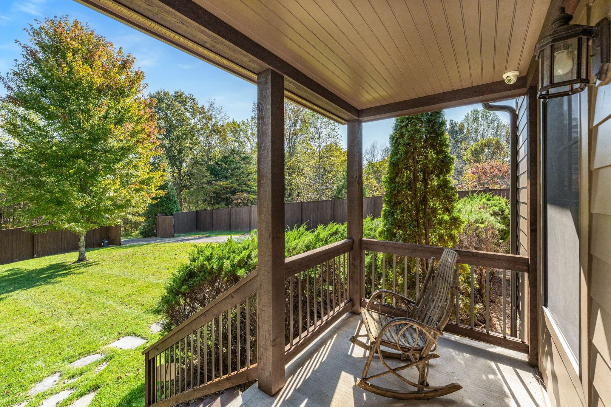 1257 Harris Hollow Road Charlotte, TN 37036 - Photo 5 of 53 a view of a porch with couches chairs and wooden fence