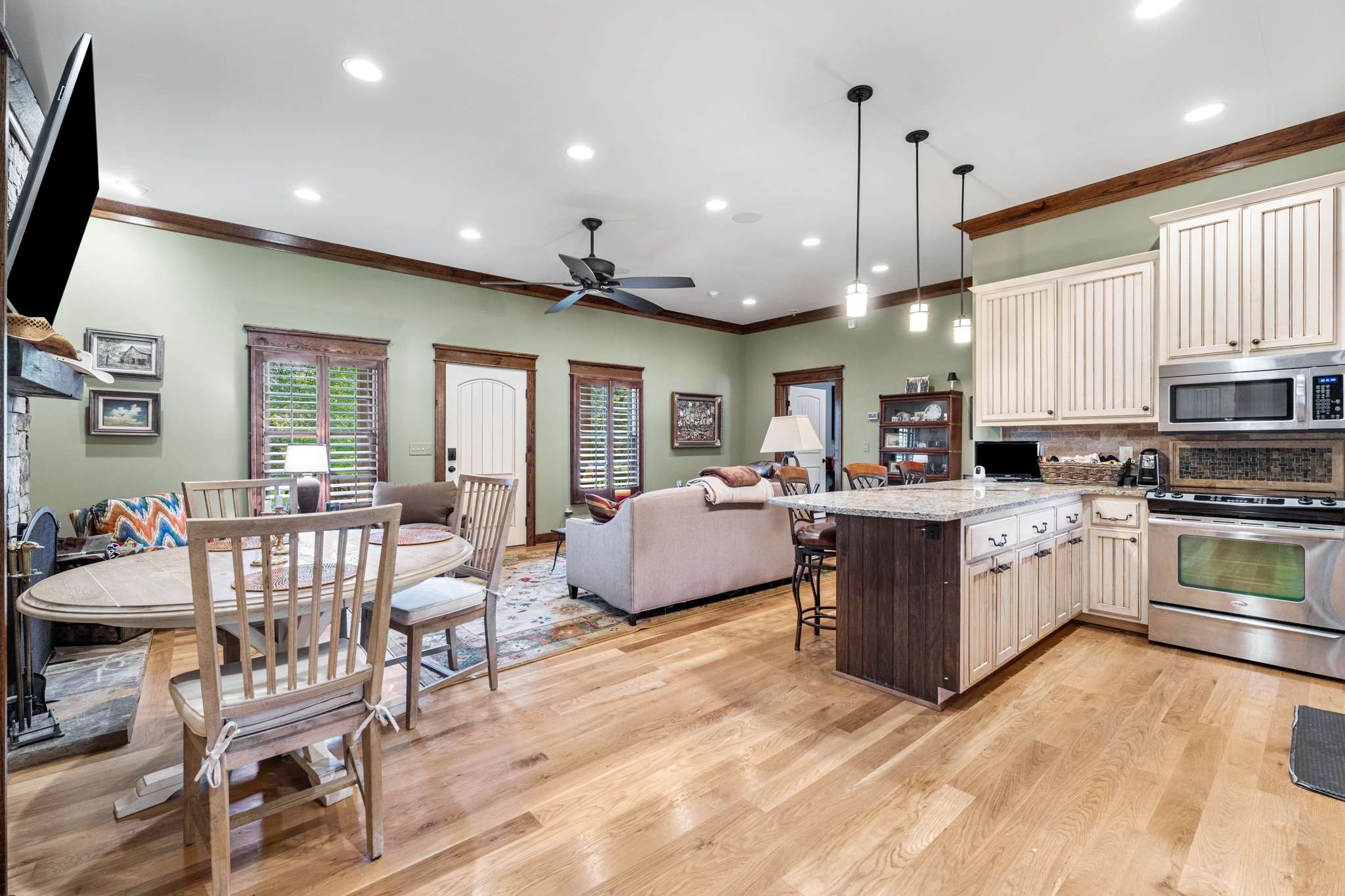 1257 Harris Hollow Road Charlotte, TN 37036 - Photo 6 of 53 a large white kitchen with lots of counter space a sink and appliances