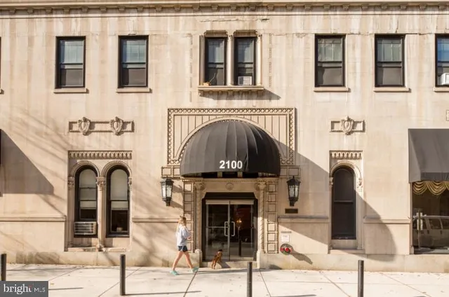 a front view of a house with many windows
