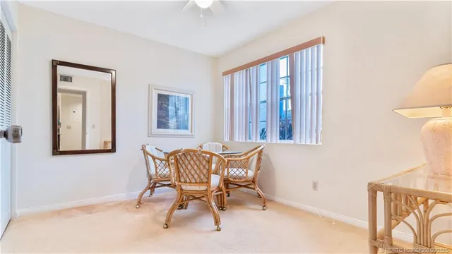a view of a bedroom with furniture and a window