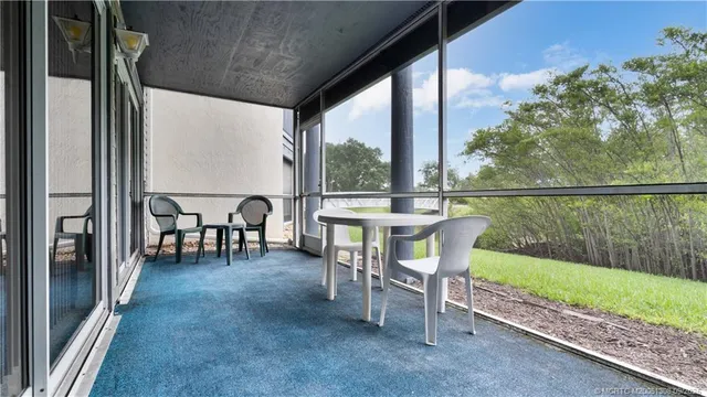 a open kitchen with a table and chairs