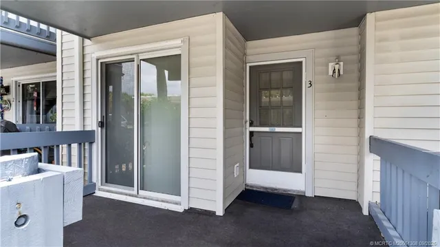 a view of a swimming pool with a table and chairs