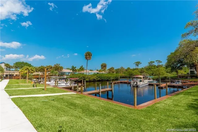 a bathroom with a sink and wooden floor
