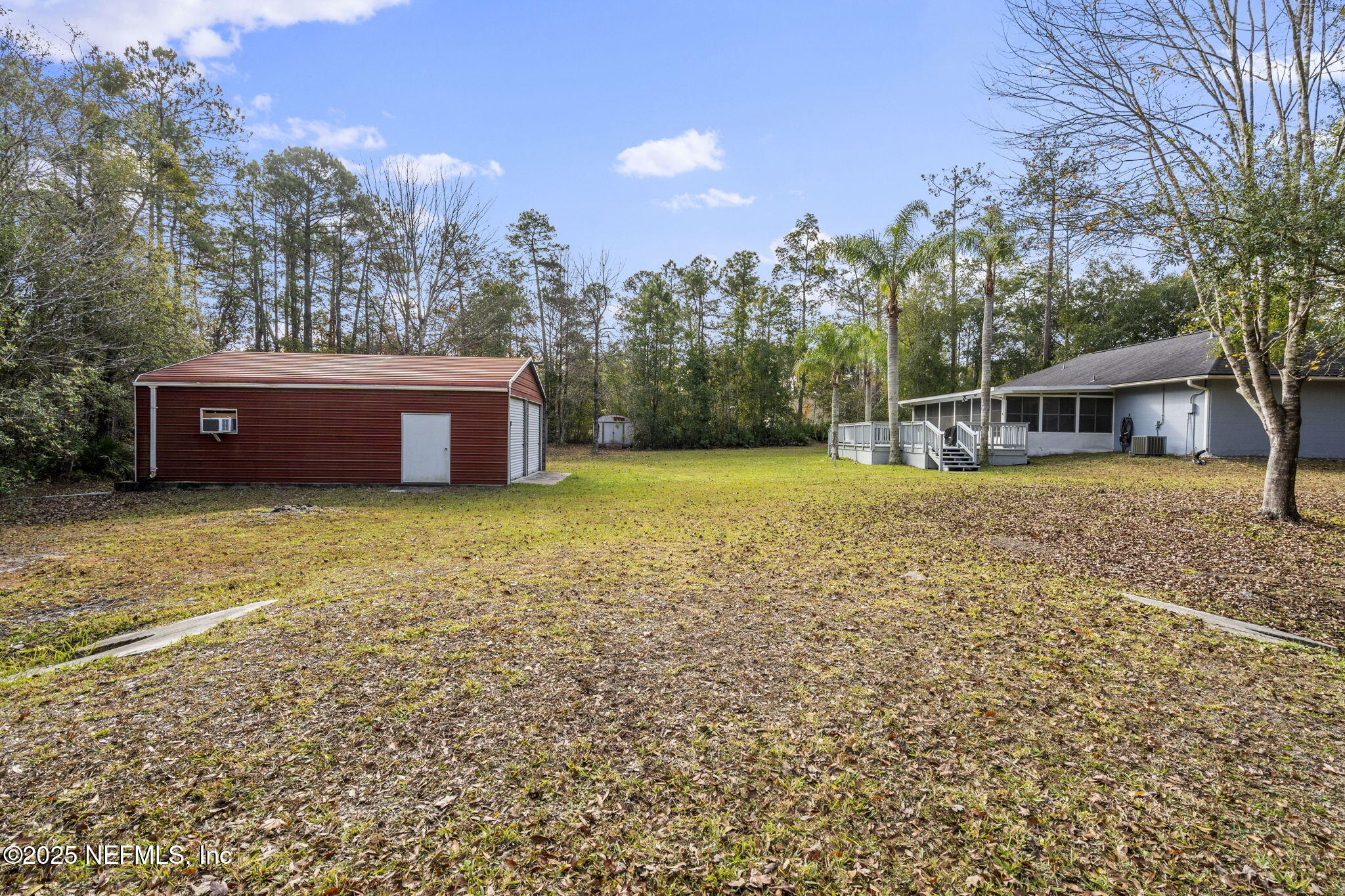 26 Bullrush Court Middleburg, FL 32068 - Photo 32 of 43 a view of a house with a yard and sitting area