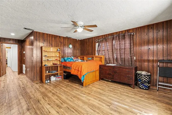 a bedroom with furniture and window
