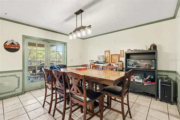 a very nice looking dining room with a table and chairs