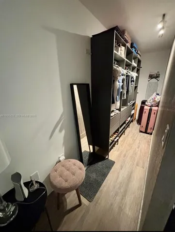 a view of a livingroom with furniture and hardwood floor