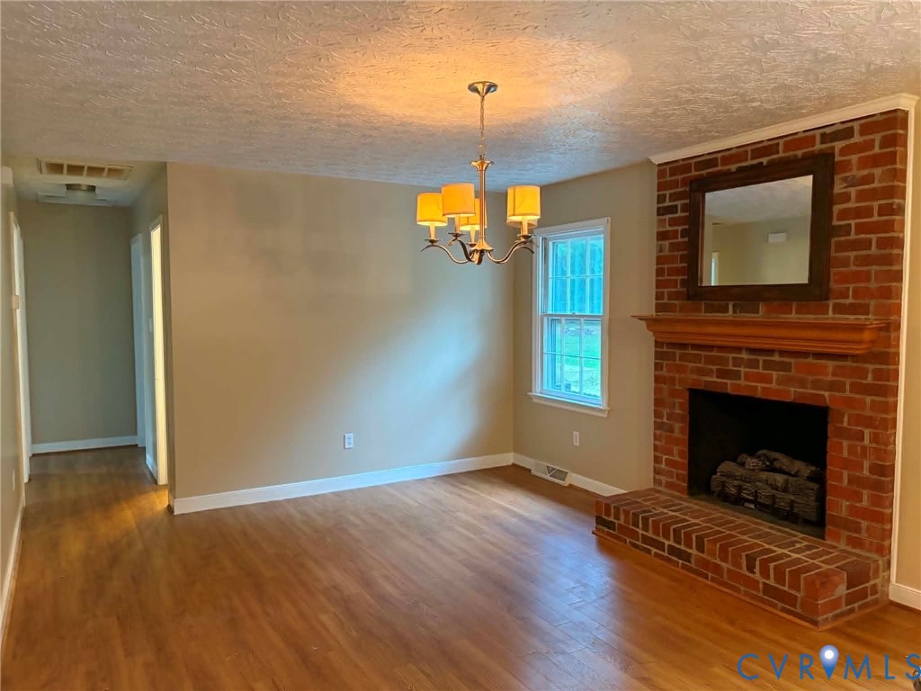 3766 Venter Road Aylett, VA 23009 - Photo 8 of 28 Dining area featuring wood-finish flooring, a bric