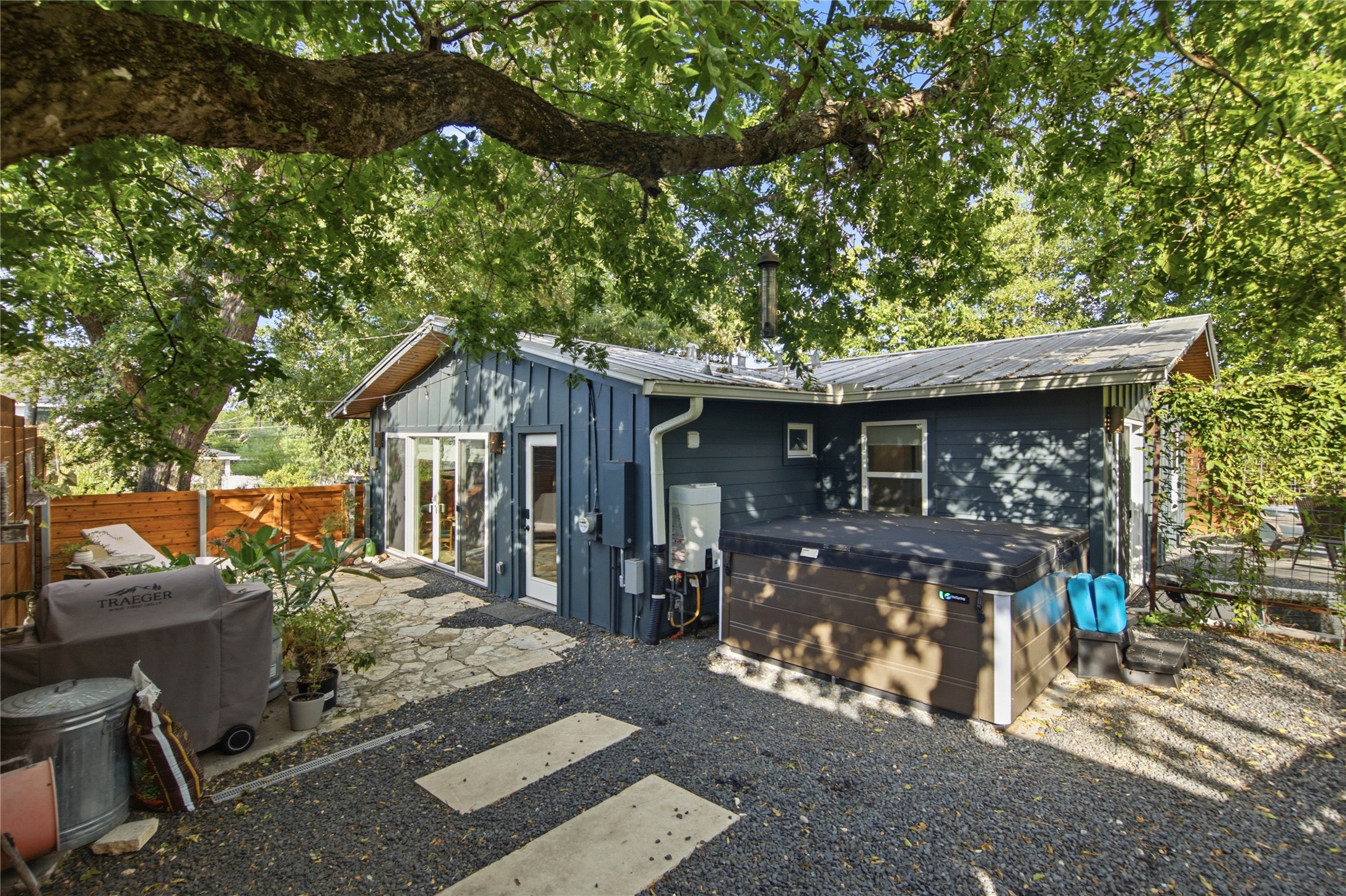 5600 Ledesma Road Austin, TX 78721 - Photo 23 of 36 Mature trees shade a private backyard retreat complete with a stone patio and spa.