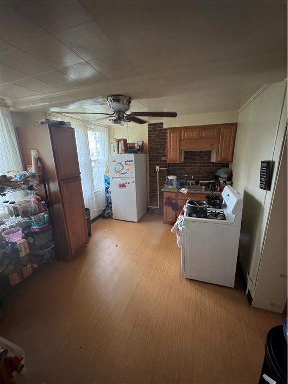 125 Frazier Avenue McKees Rocks, PA 15136 - Photo 5 of 13 a view of a storage & utility room with two washing machine
