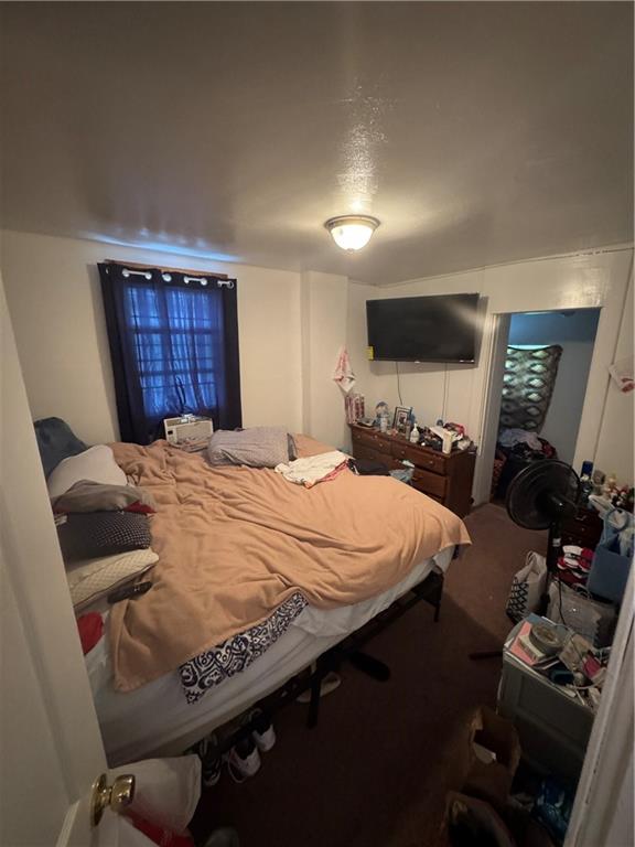 125 Frazier Avenue McKees Rocks, PA 15136 - Photo 10 of 13 a bedroom with a bed and wooden floor