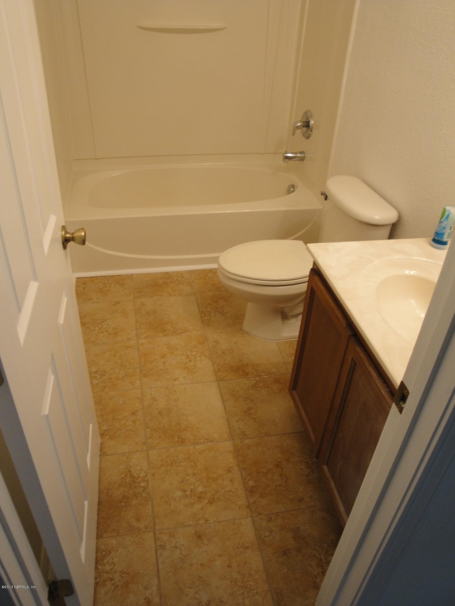 7266 South Rampart Ridge Jacksonville, FL 32244 - Photo 13 of 22 a bathroom with a sink and a toilet