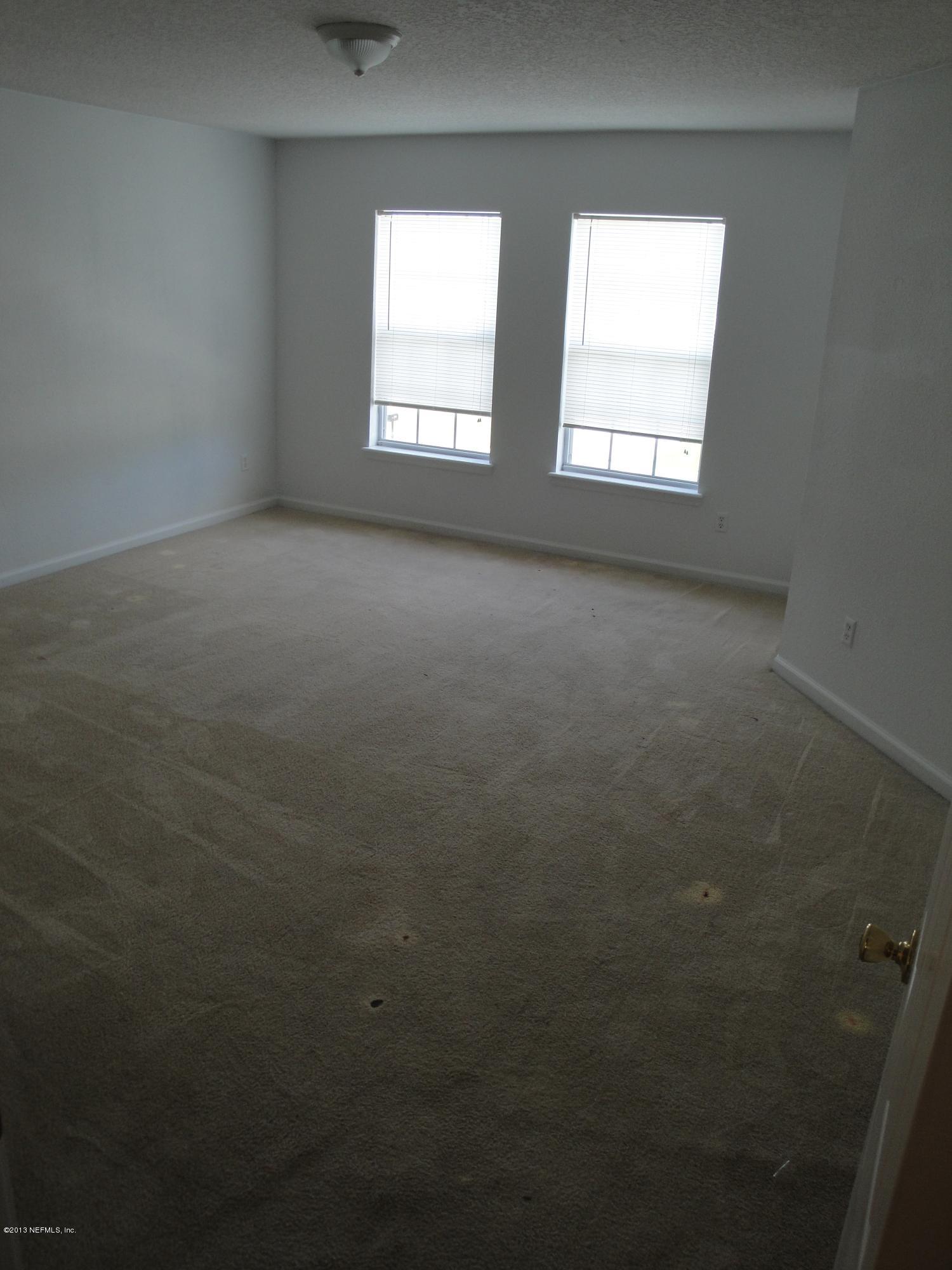 7266 South Rampart Ridge Jacksonville, FL 32244 - Photo 14 of 22 an empty room with a window