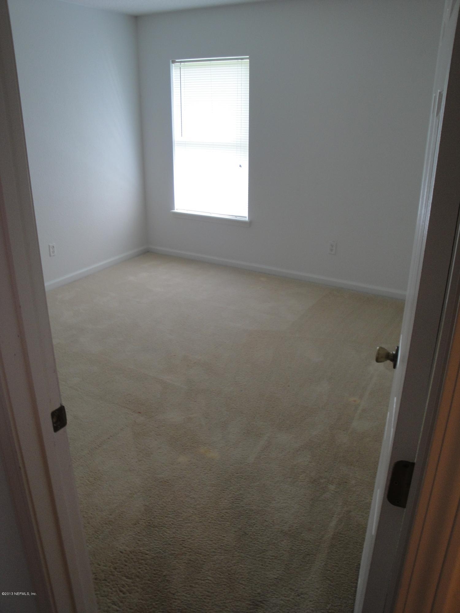 7266 South Rampart Ridge Jacksonville, FL 32244 - Photo 16 of 22 an empty room with a window