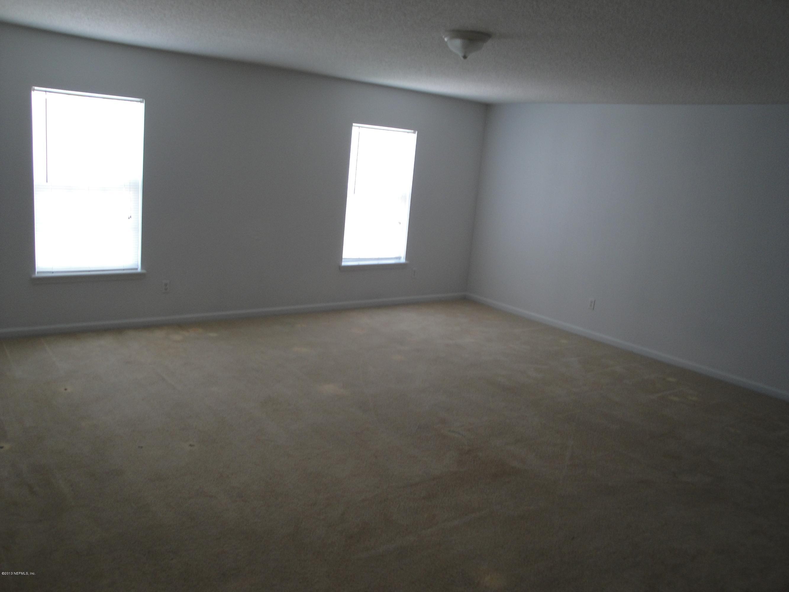 7266 South Rampart Ridge Jacksonville, FL 32244 - Photo 17 of 22 an empty room that has a window in it