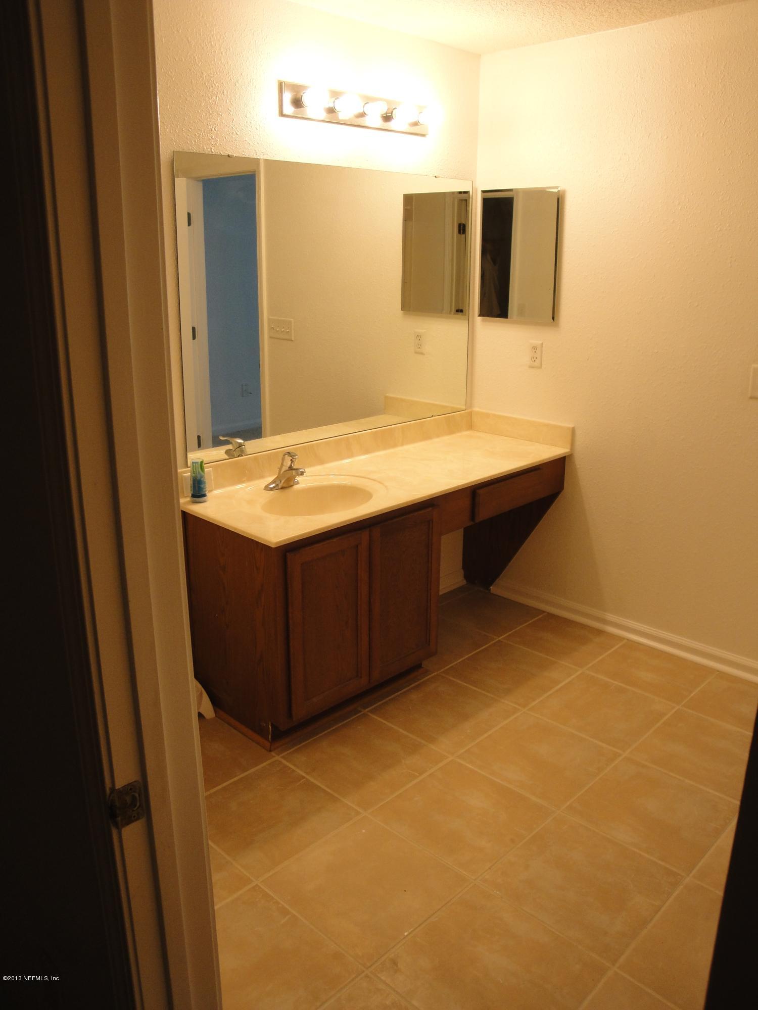7266 South Rampart Ridge Jacksonville, FL 32244 - Photo 20 of 22 a room with a sink