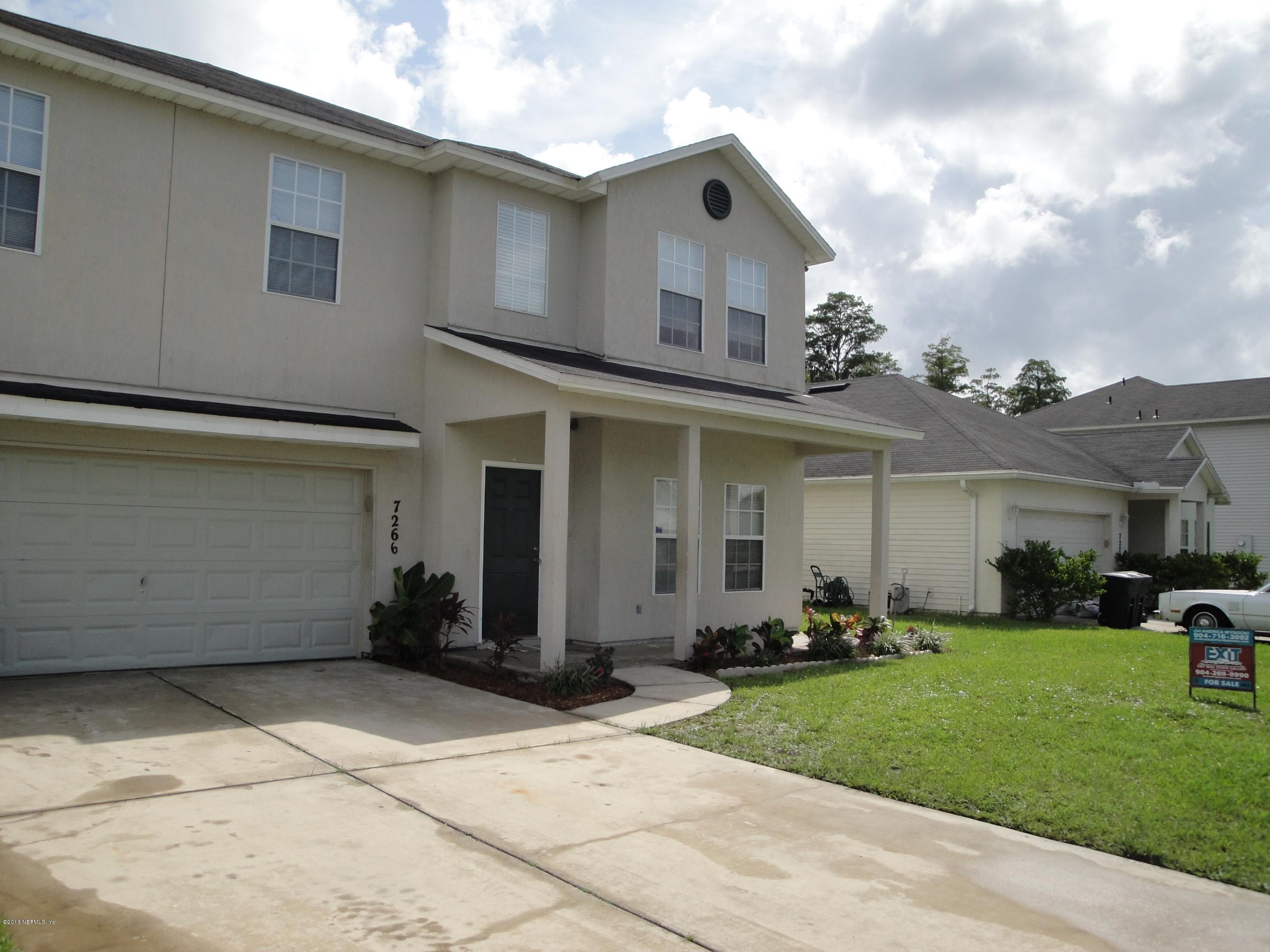 7266 South Rampart Ridge Jacksonville, FL 32244 - Photo 2 of 22 a view of a white house with a big yard and potted plants