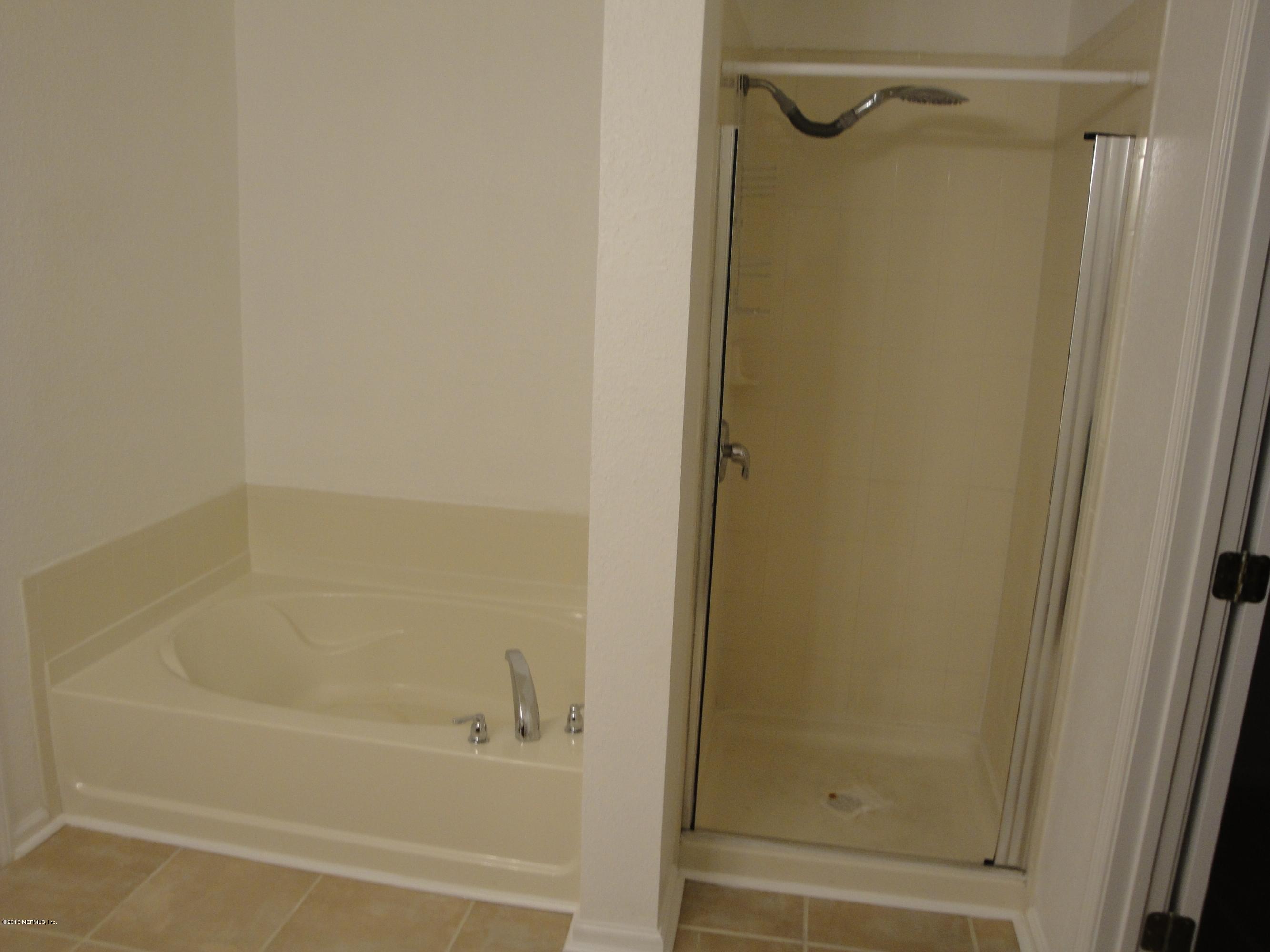 7266 South Rampart Ridge Jacksonville, FL 32244 - Photo 21 of 22 a bathroom with a shower and a bath tub