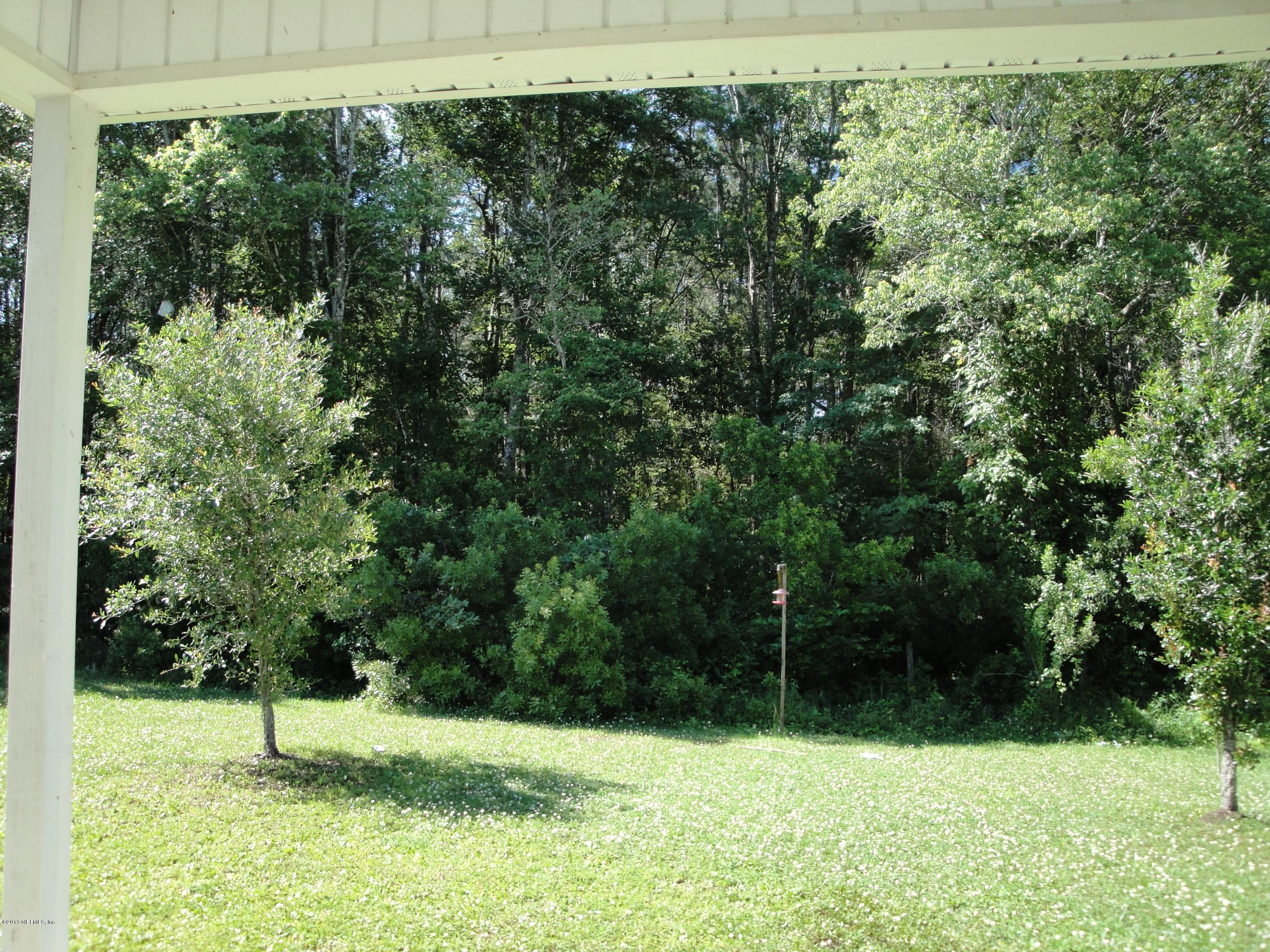 7266 South Rampart Ridge Jacksonville, FL 32244 - Photo 6 of 22 a view of backyard with green space
