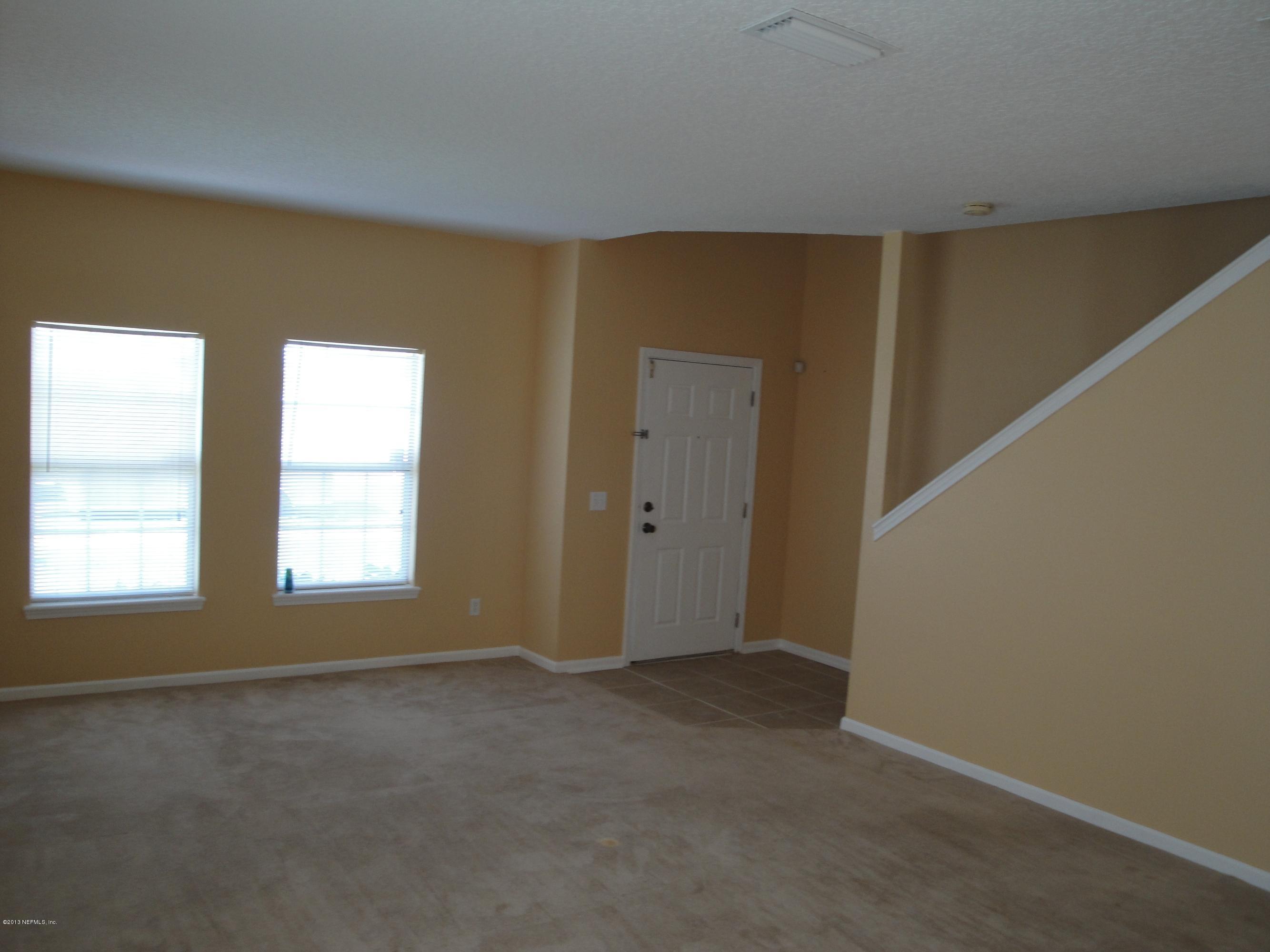 7266 South Rampart Ridge Jacksonville, FL 32244 - Photo 7 of 22 a view of an empty room with a window