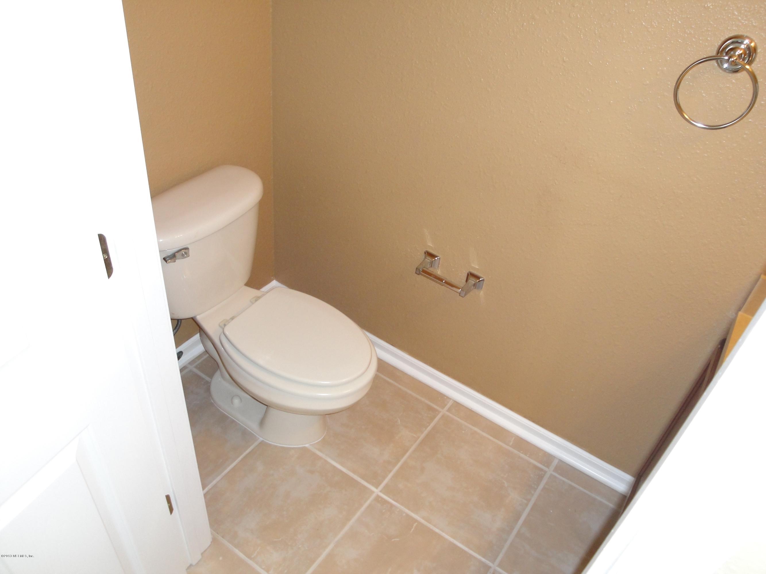 7266 South Rampart Ridge Jacksonville, FL 32244 - Photo 9 of 22 a white toilet sitting next to a shower