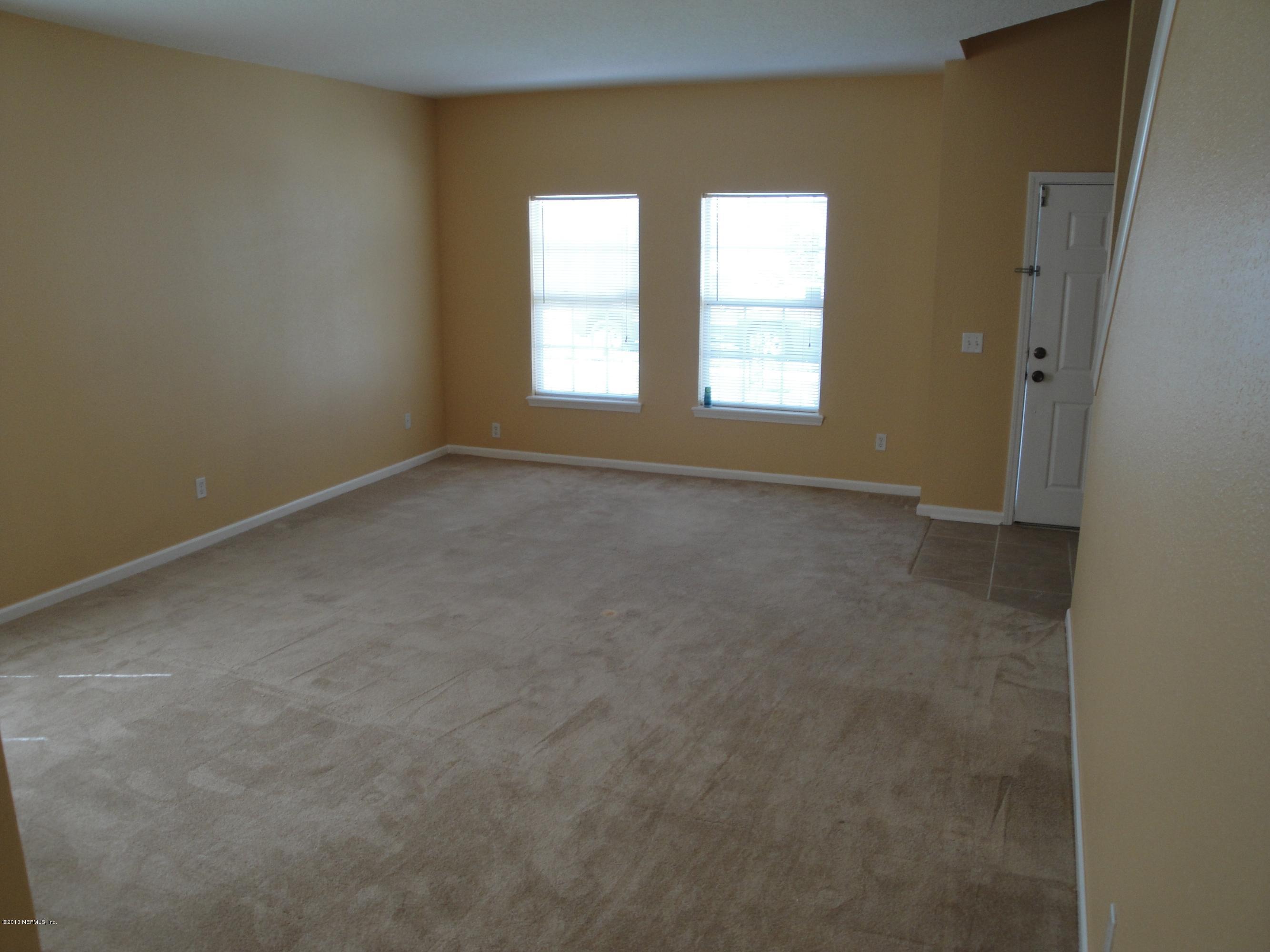 7266 South Rampart Ridge Jacksonville, FL 32244 - Photo 10 of 22 an empty room with windows