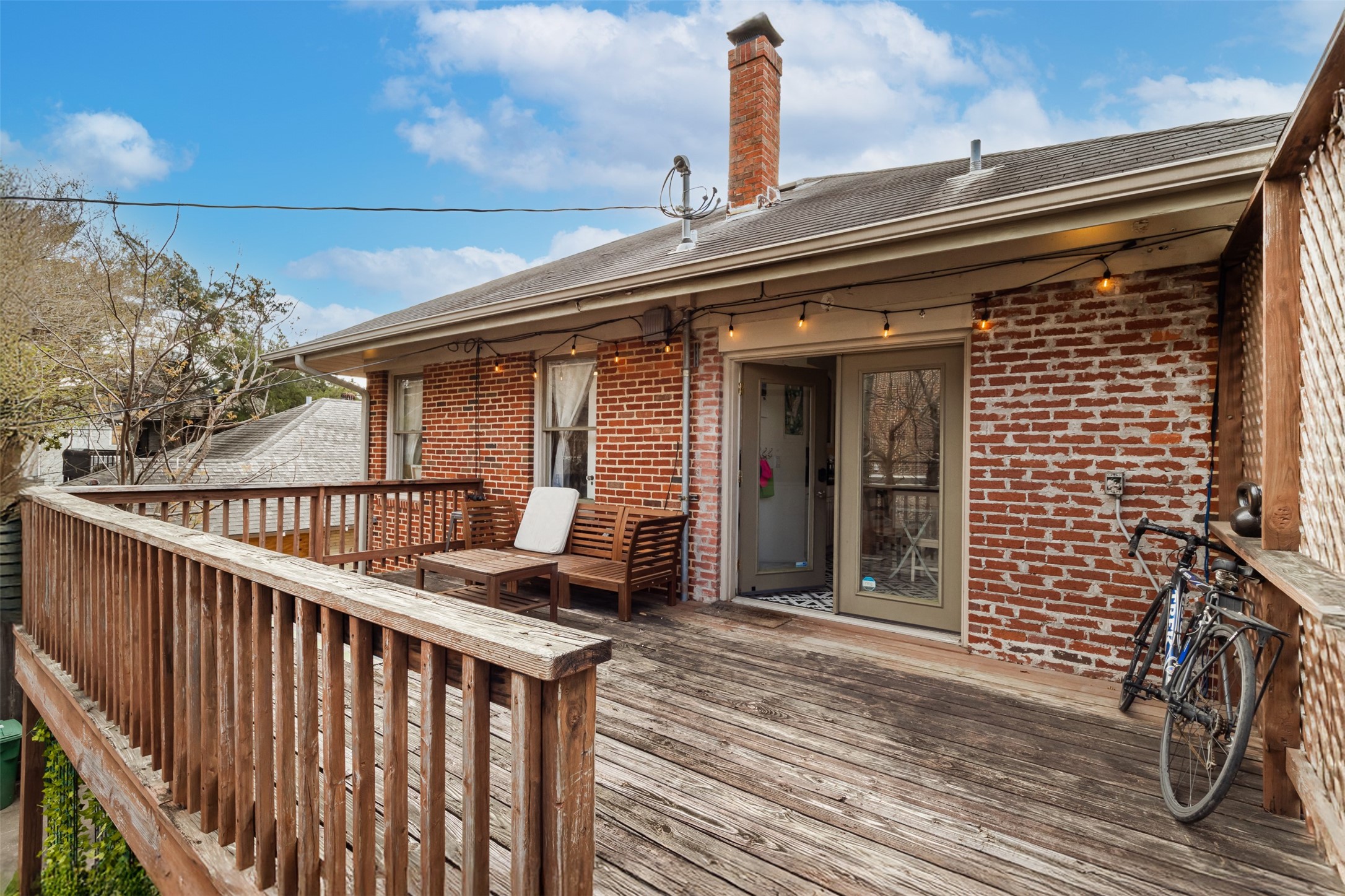 528 Hawthorne Street Houston, TX 77006 - Photo 11 of 34 a roof deck view with wooden floor and fence