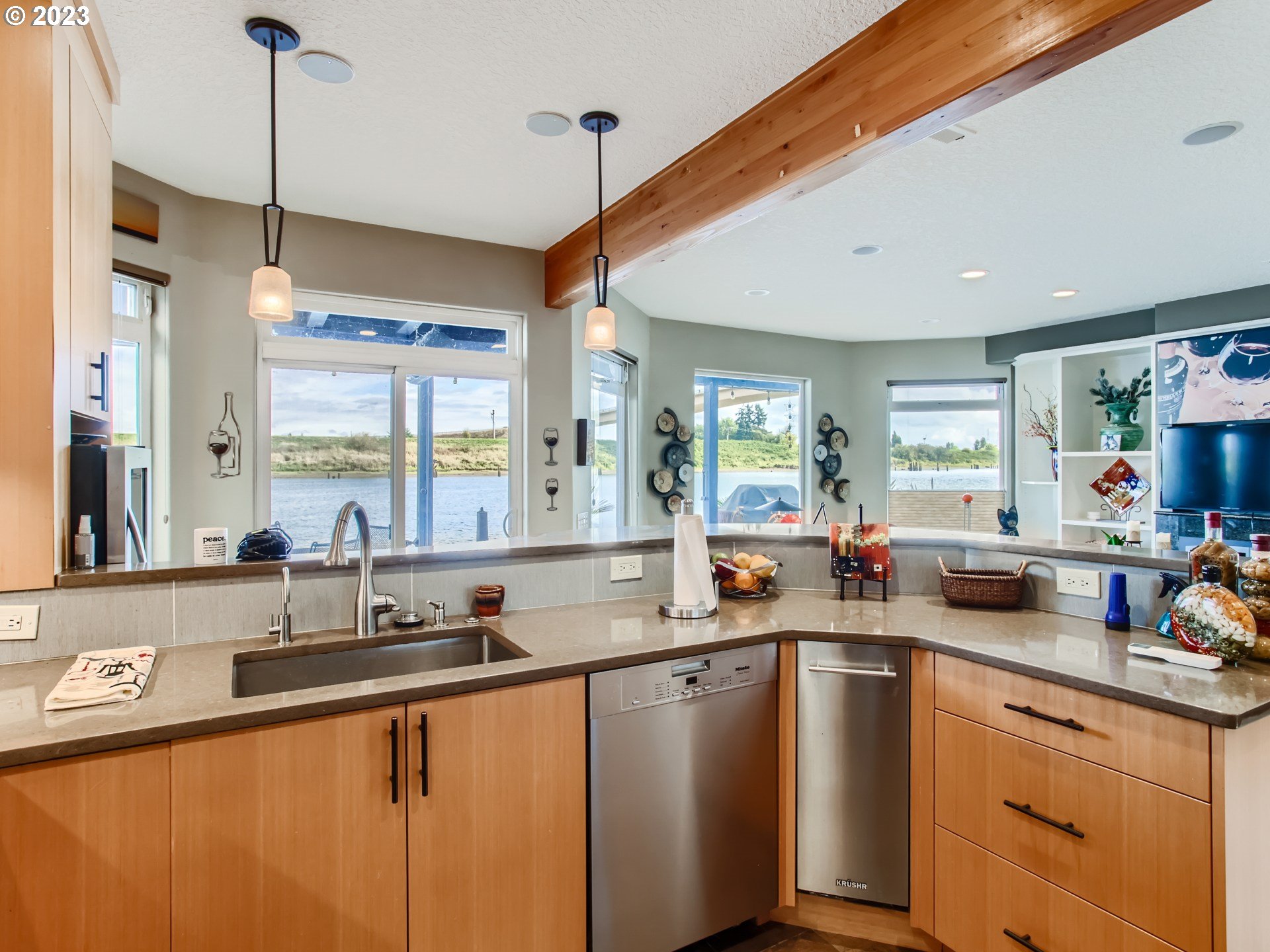 14565 Northwest Larson Road, Unit 15 Portland, OR 97231 - Photo 11 of 27 a kitchen with sink a window and chairs