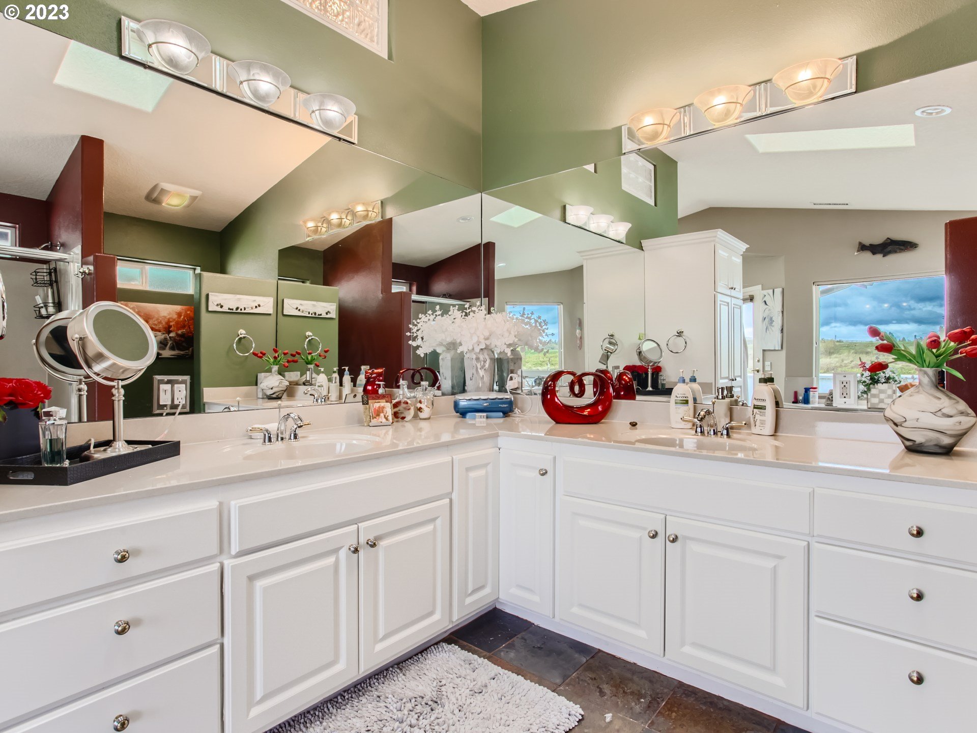 14565 Northwest Larson Road, Unit 15 Portland, OR 97231 - Photo 17 of 27 a bathroom with a sink vanity and mirror