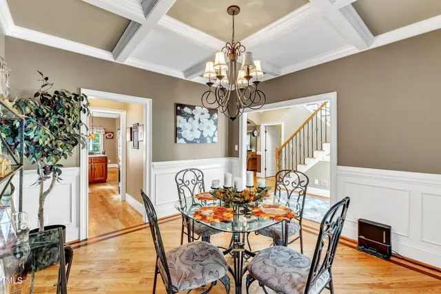 a kitchen with stainless steel appliances granite countertop wooden cabinets a stove a sink and dishwasher