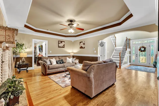 a bedroom with a bed couch and window