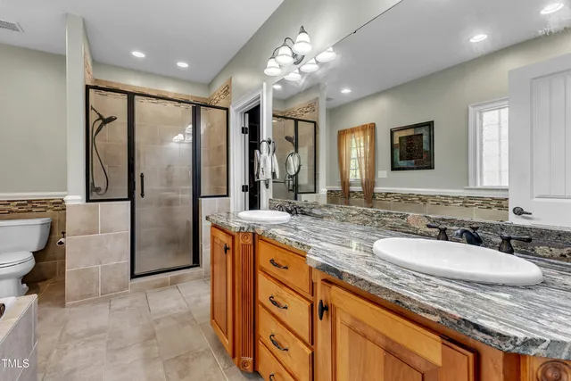 a bed room with a bed and a tv