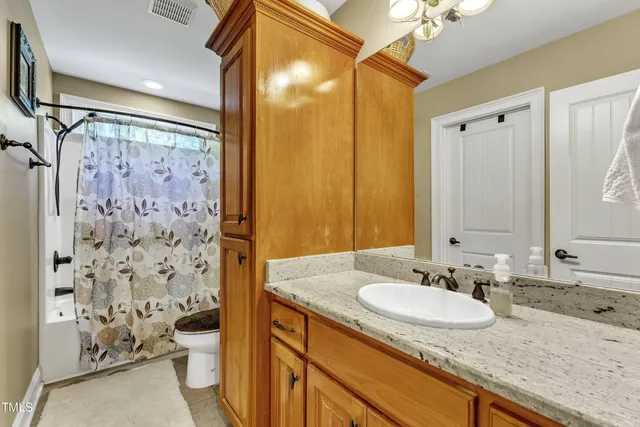 an aerial view of a houses with a yard