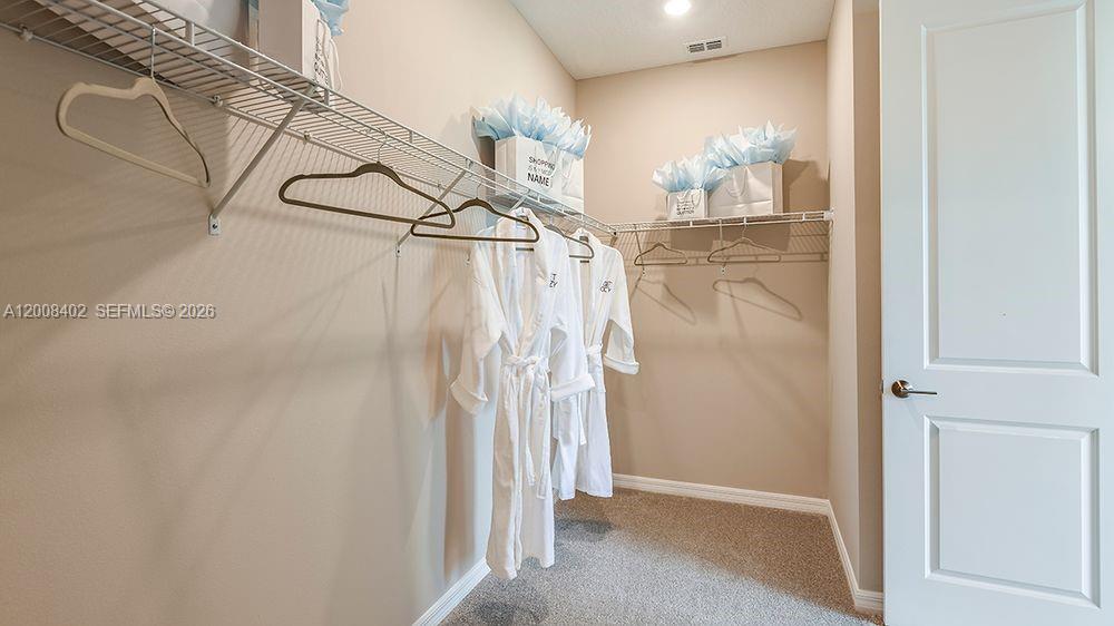657 Southeast Ranch Oak Circle Port St. Lucie, FL 34984 - Photo 20 of 43 a view of a bathroom with a shower