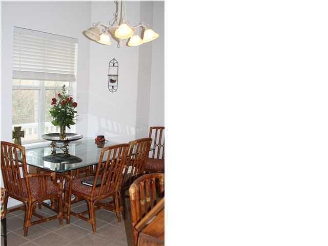 312 East Nursery Road Santa Rosa Beach, FL 32459 - Photo 1 of 3 a view of a dining room with furniture and chandelier