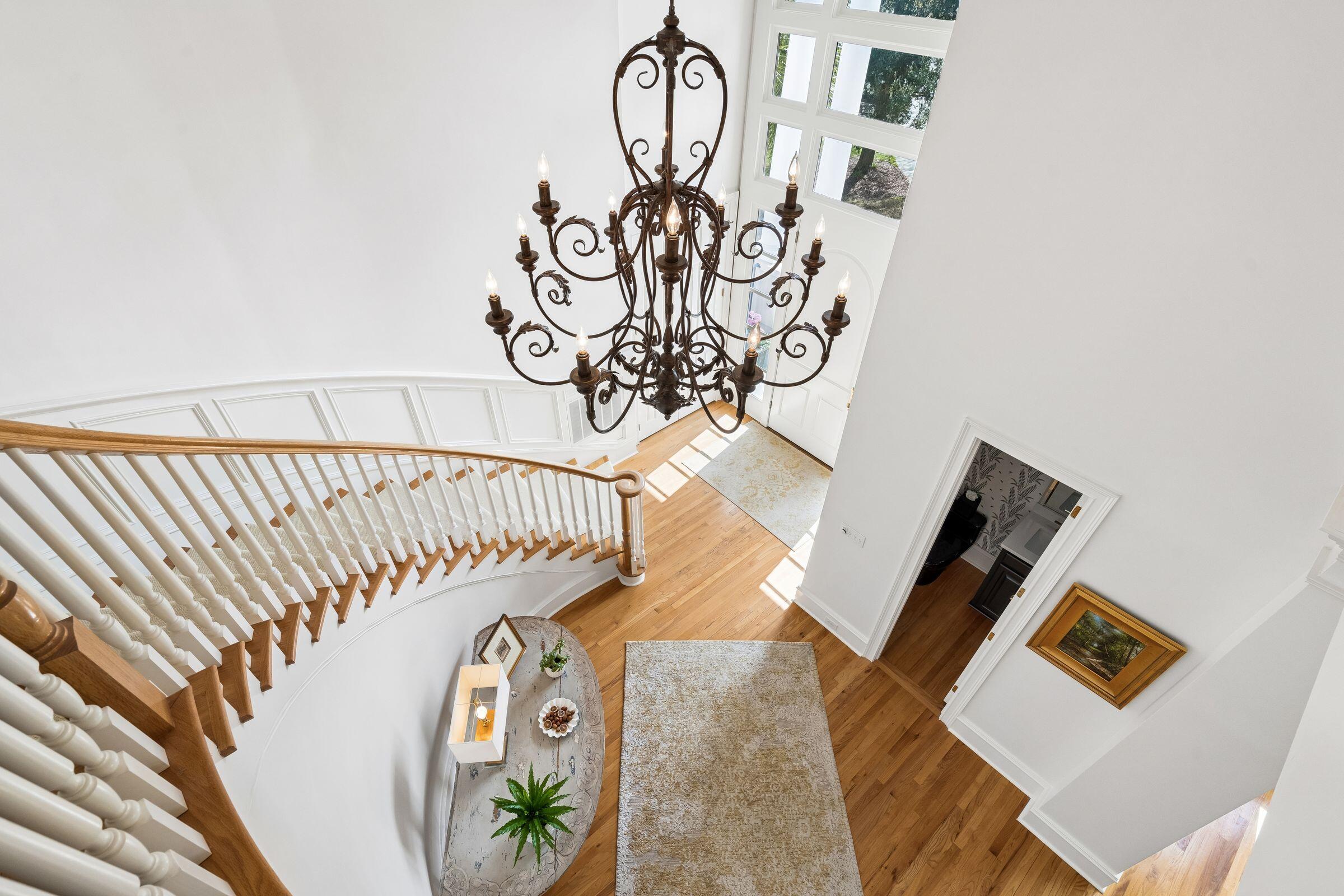 1663 Omni Boulevard Mount Pleasant, SC 29466 - Photo 40 of 73 Sweeping Curved Staircase