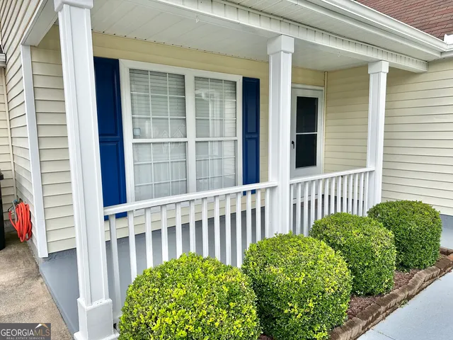 a view of a house with a small yard