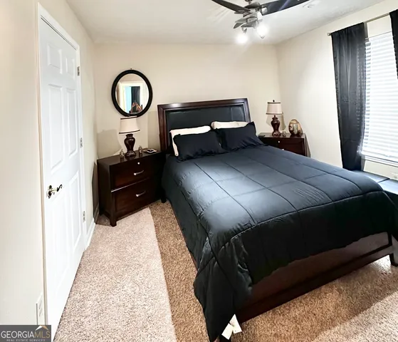 a bed room with a bed and a chandelier