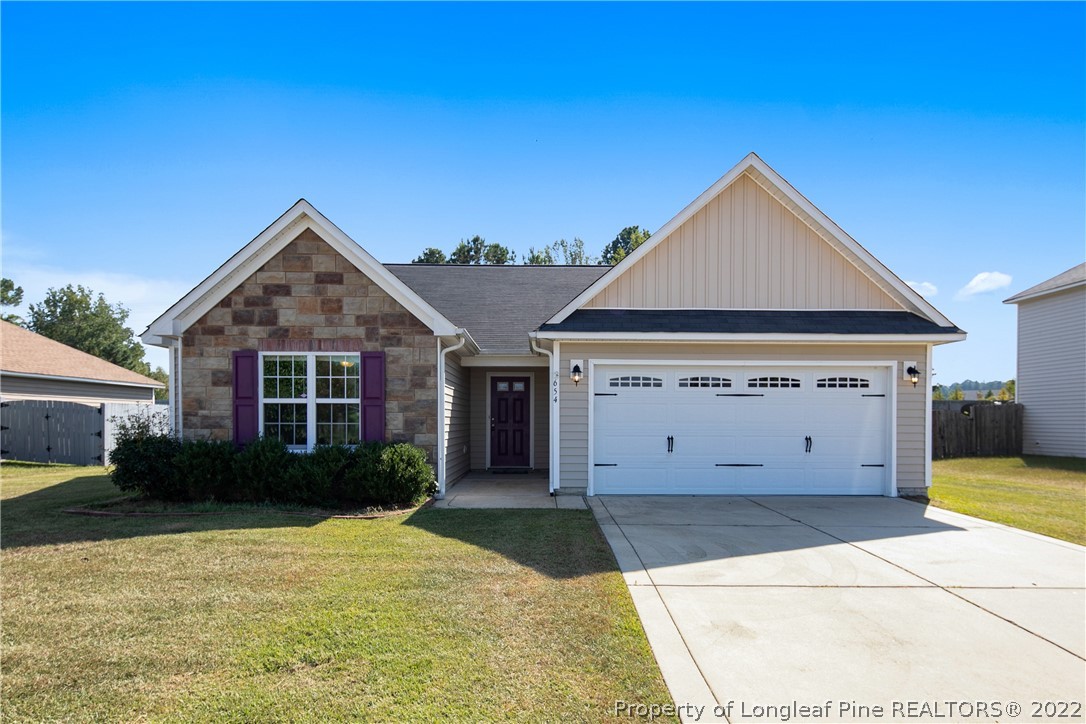 654 Hogart Street Raeford, NC 28376 - Photo 1 of 35 a view of a house with backyard