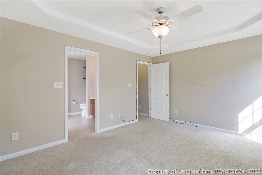 654 Hogart Street Raeford, NC 28376 - Photo 23 of 35 a view of a room with a ceiling fan and a window