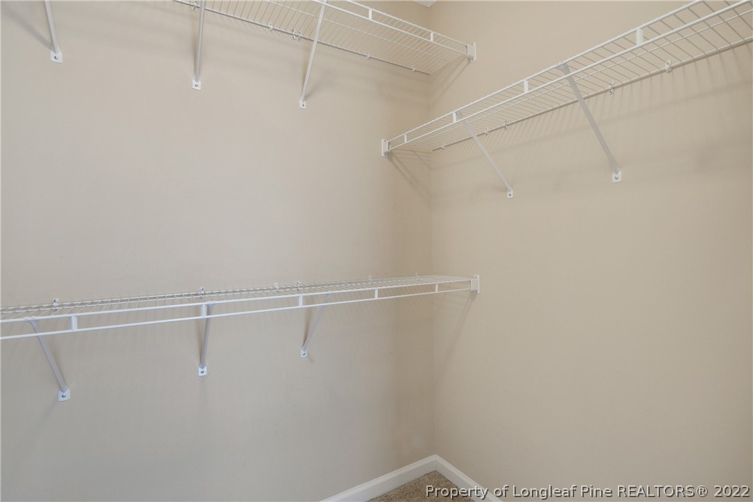 654 Hogart Street Raeford, NC 28376 - Photo 26 of 35 a view of a room with racks on the wall